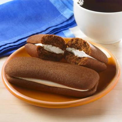 Drake's Devil Dogs: devil Dogs cakes on a plate beside coffee