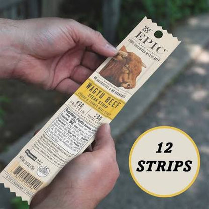 EPIC Wagyu beef snack strips: individual Wagyu beef snack strip held in a hand
