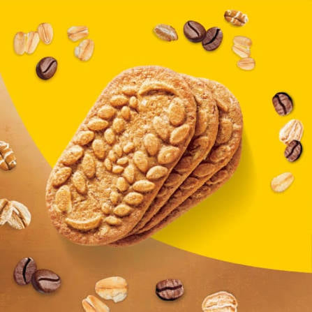 Stack of belVita Vanilla Mocha breakfast biscuits with coffee beans and grain illustrations.