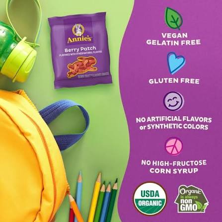Annie's Berry Patch Fruit Snacks pouch beside a lunchbox and banana.