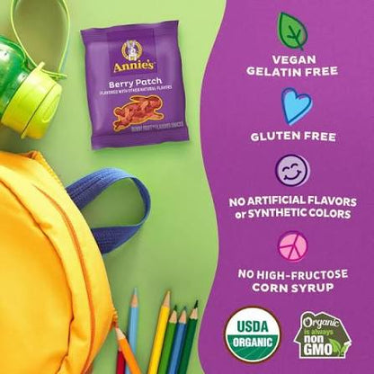 Annie's Berry Patch Fruit Snacks pouch beside a lunchbox and banana.